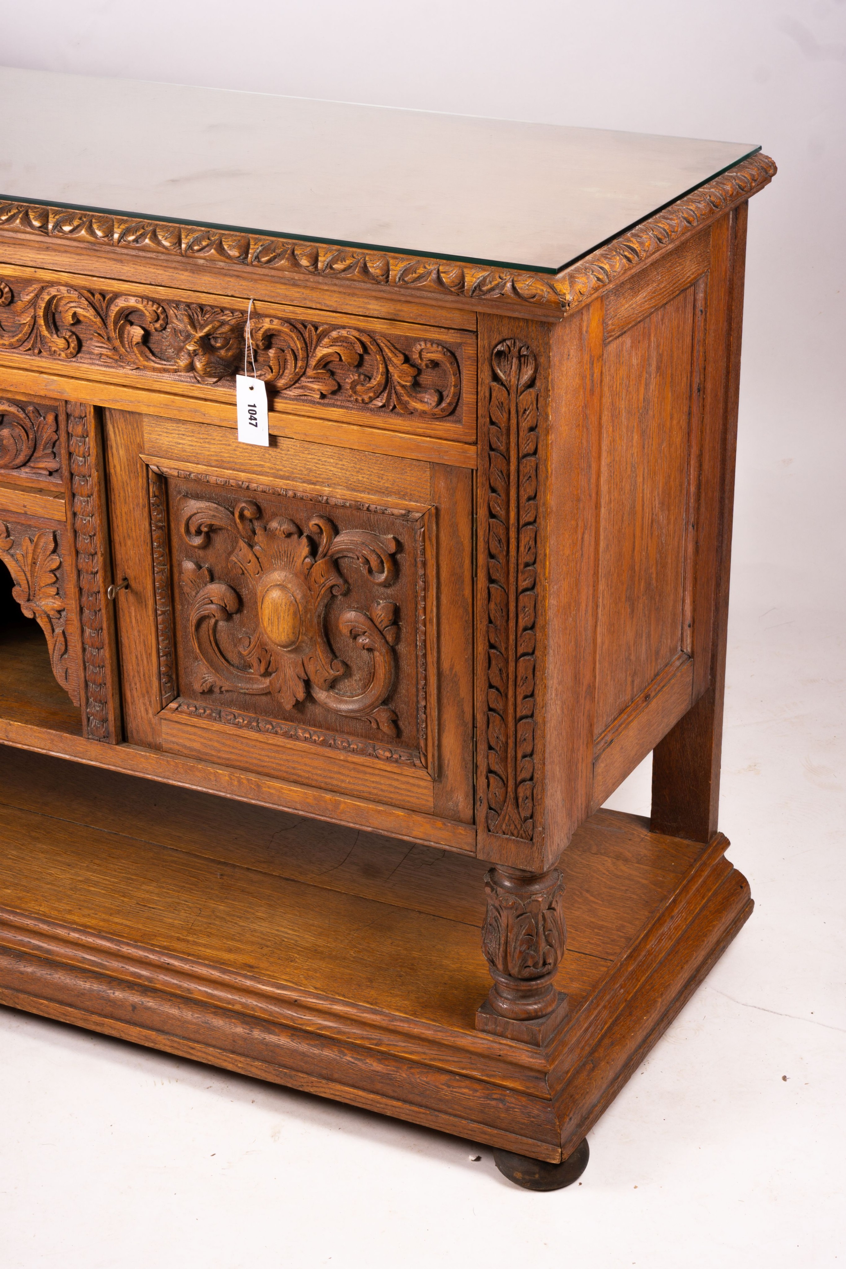 A late 19th century Flemish carved oak buffet, length 158cm, depth 58cm, height 99cm